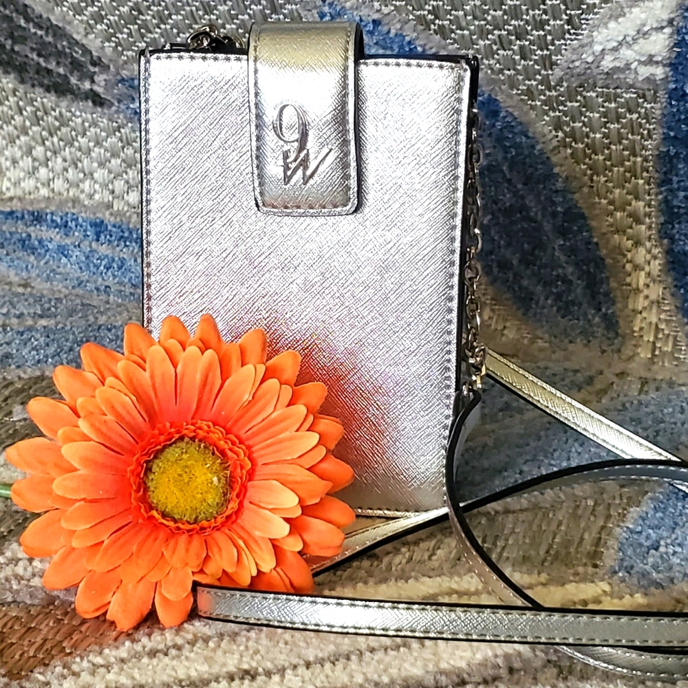 New Nine West silver accordion crossbody wallet.